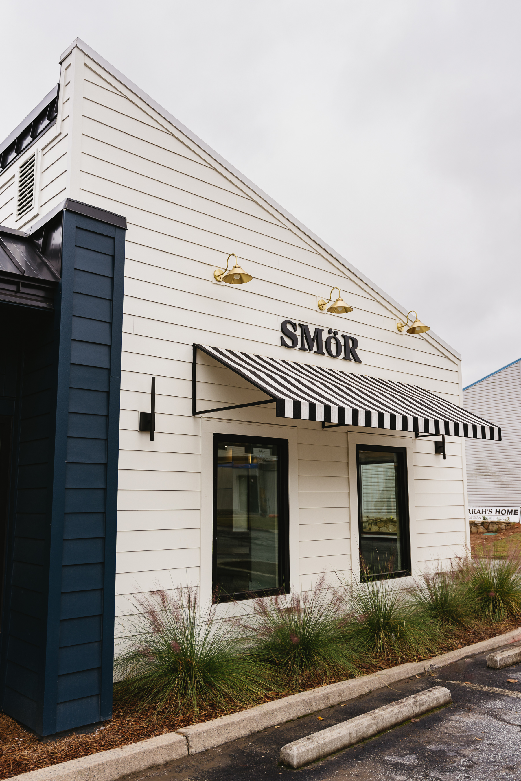 Commercial exterior - white siding with awning