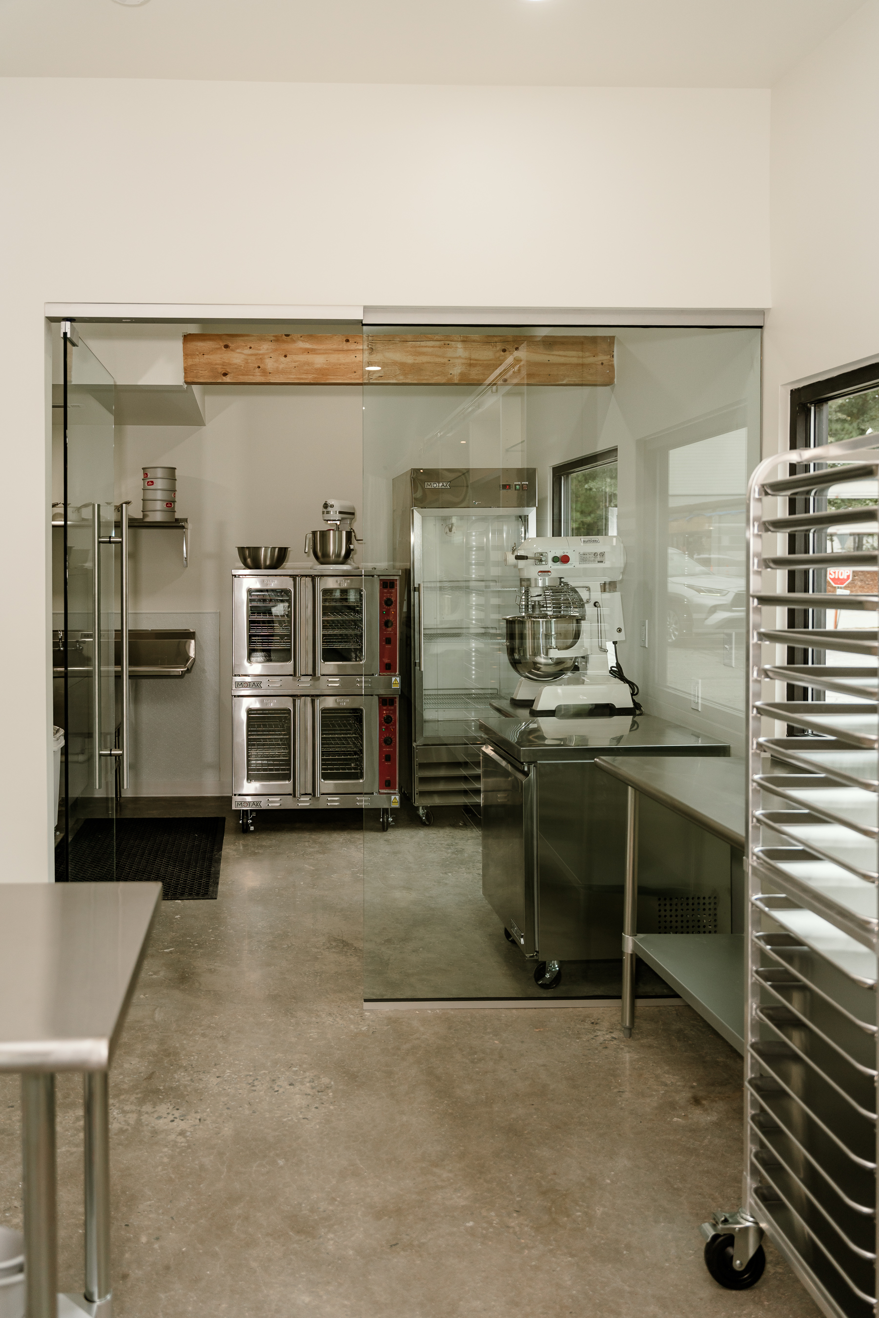 Commercial kitchen buildout with glass partition